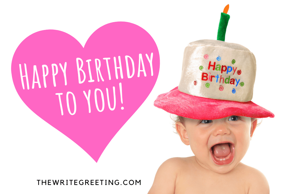 Young toddler boy with birthday colorful hat on his head