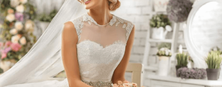 blond bride sitting in beautiful wedding dress