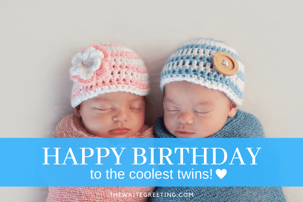 Boy and girl twins snuggled together in pink and blue