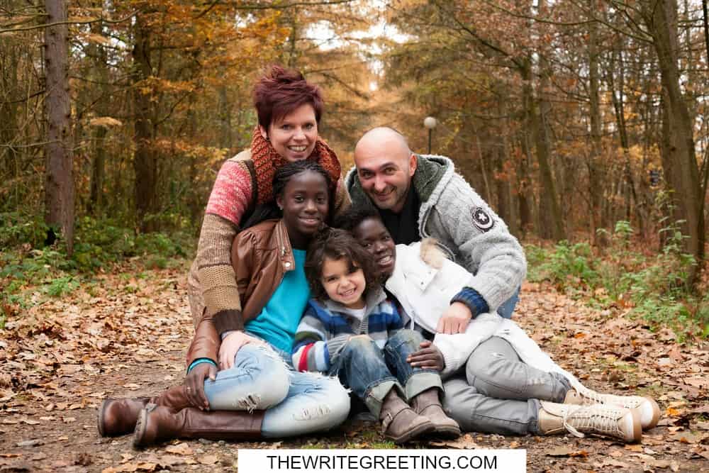 Multi racial foster family in park