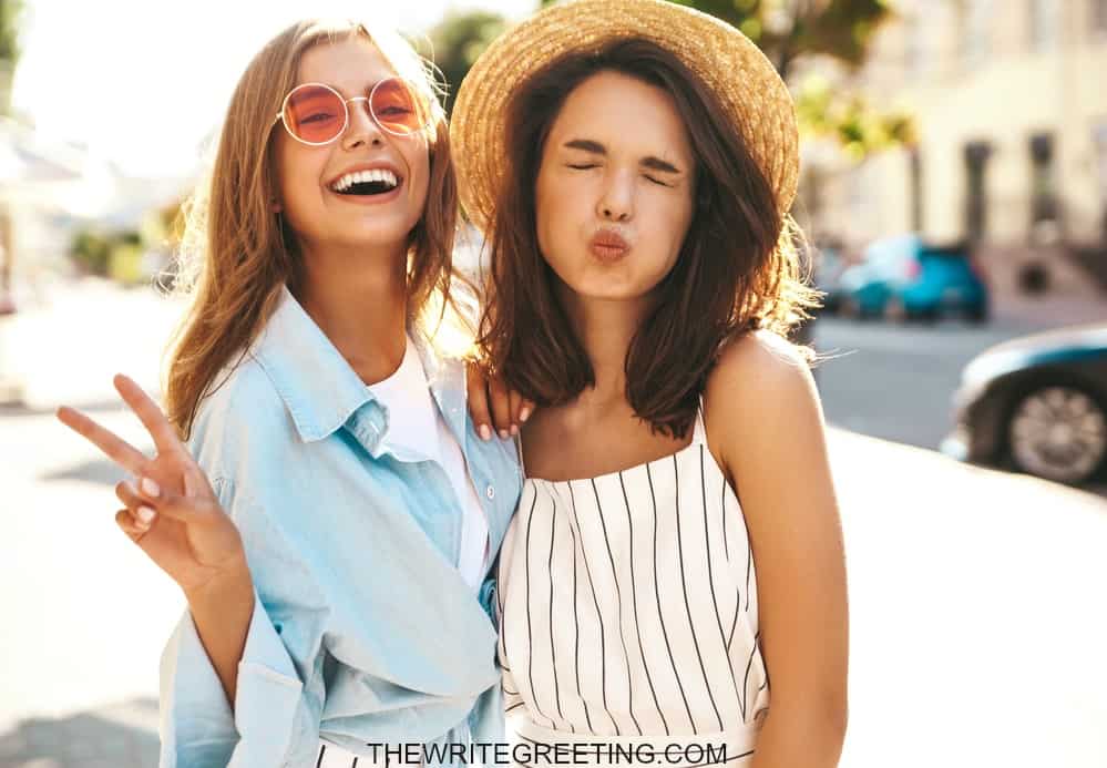 2 young girls laughing and goofing off