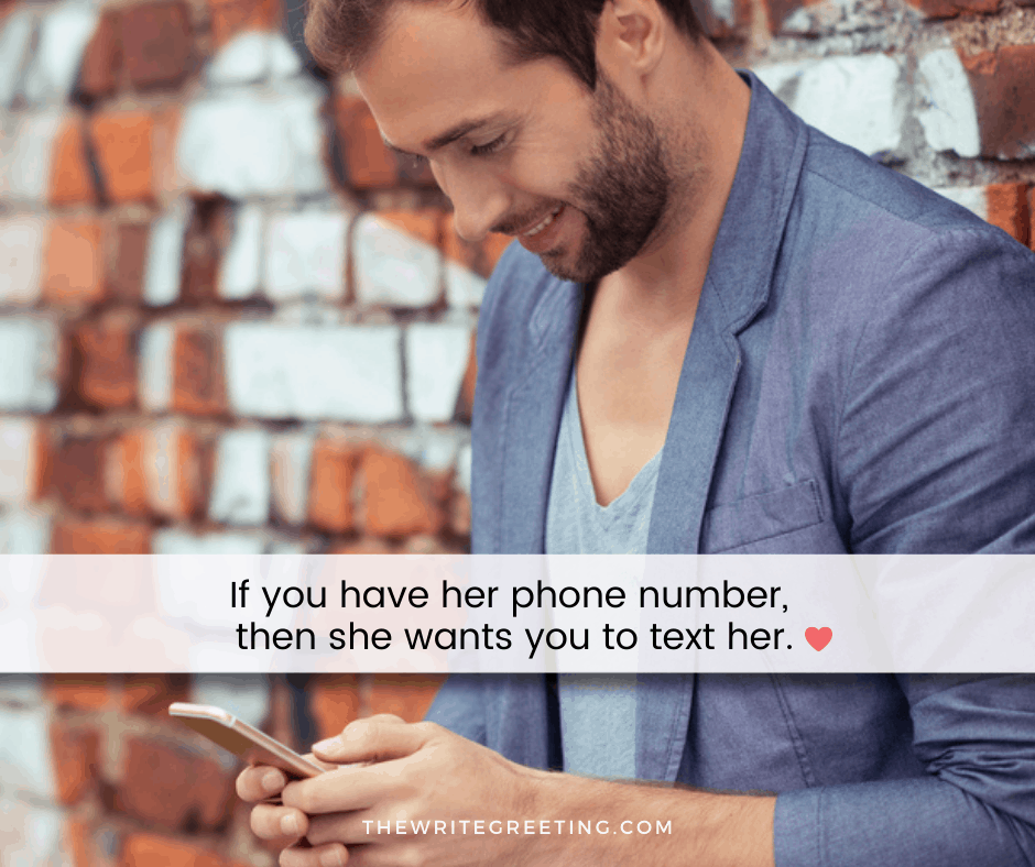 man smiling as he texts a girl
