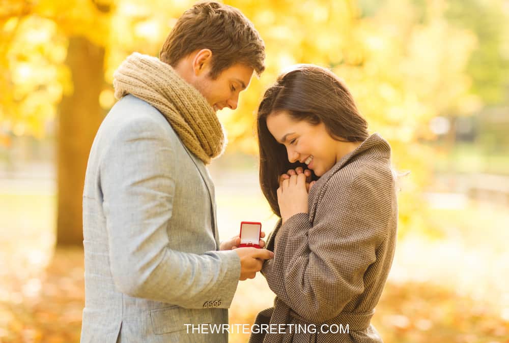 Couple getting engaged in the forest