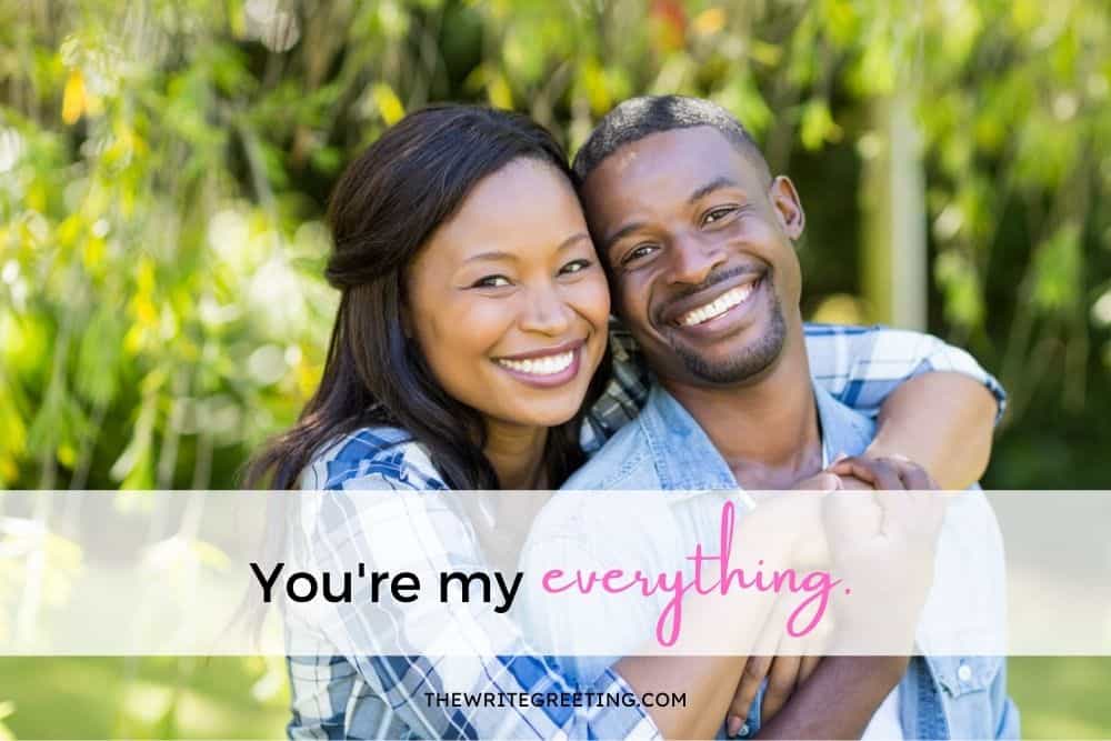 African American couple smiling at camera