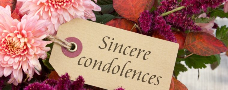 Text sincere condolences beside pink flowers