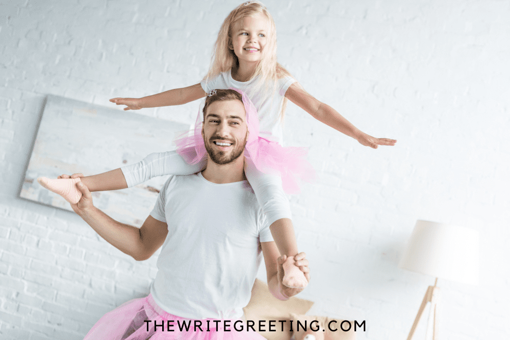 Stepdad wearing a pink tutu with his step daughter on back