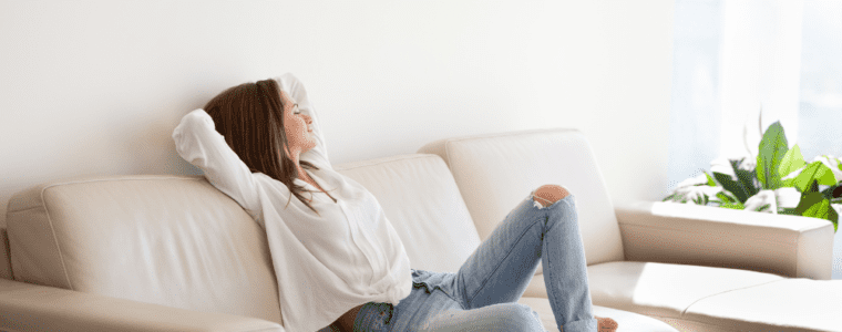 Woman relaxing on couch on the weekend