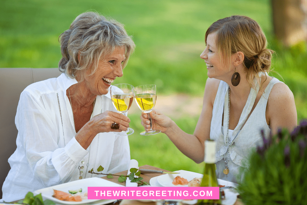 Daughter and mother in law drinking wine outdoors