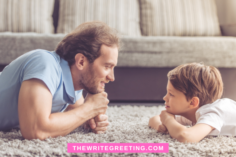 Father and toddler son on floor staring at each other