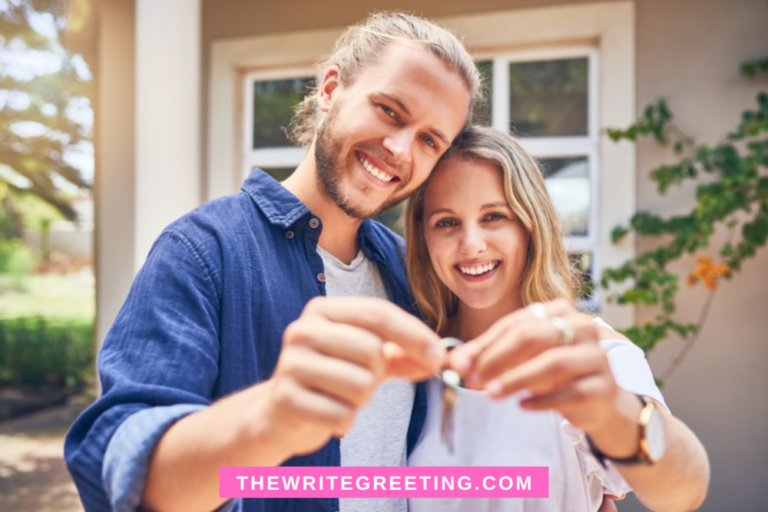 Young couple holding keys to new home in background