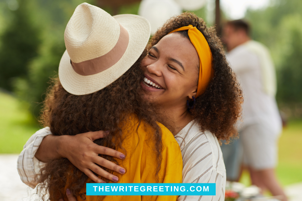 Two African American Women hugging in yellow