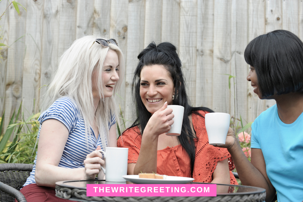 Female neighbors enjoying a cup of coffee together