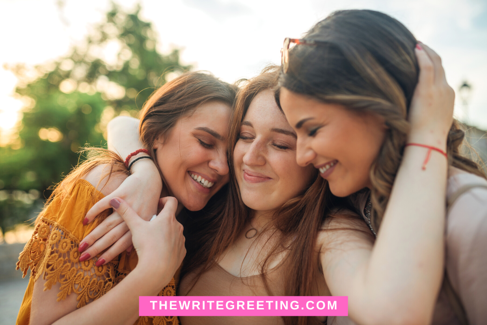 Three female friends hugging