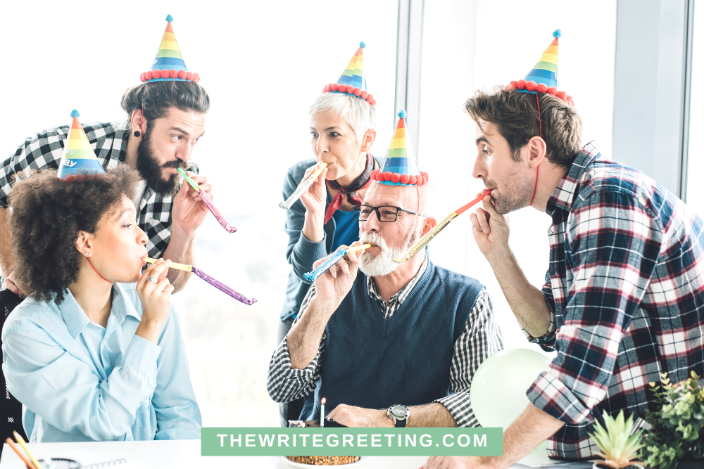 Office workers celebrate an older gentlemans birthday