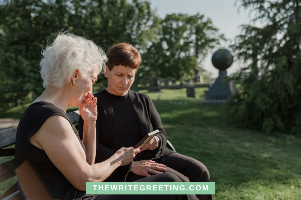 Older women sitting at graveside